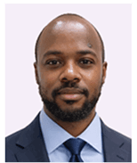 Professional headshot of a Black man with a beard in a dark suit and blue tie.