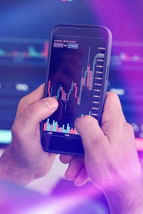 INGOT mobile trading app displayed on a smartphone, providing secure access to online trading, real-time market analysis, and global financial markets.