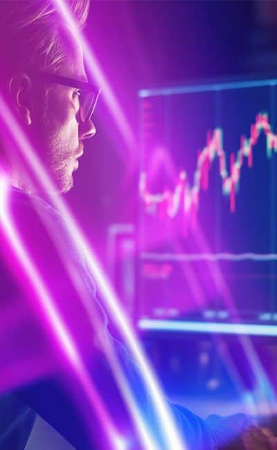 Trader analyzing live financial market charts on the INGOT web trading platform.